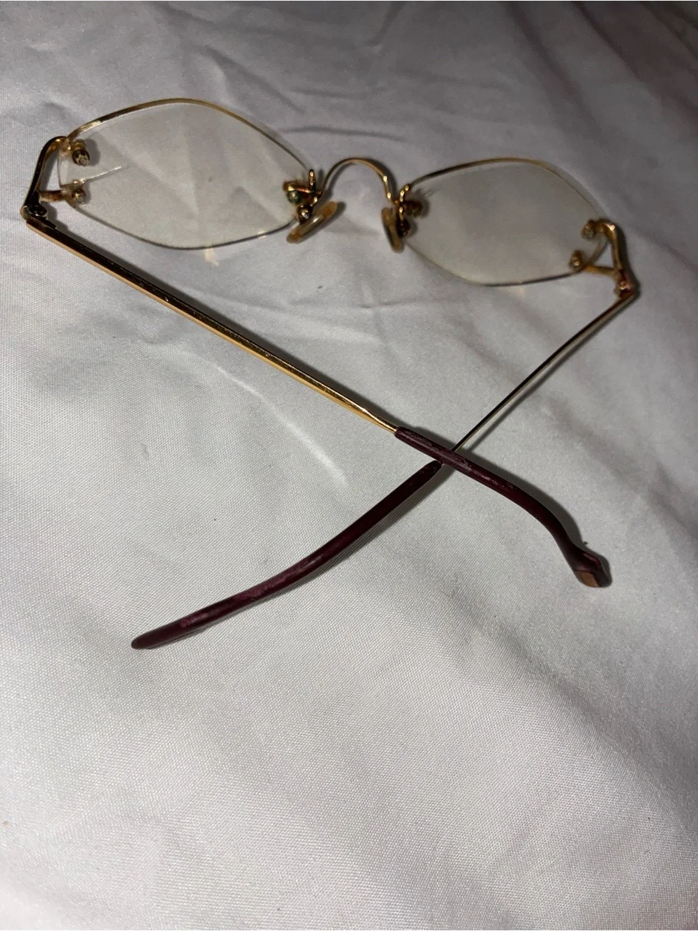 Cartier Gold Rimless Women's Glasses with Subtle Pink Temples